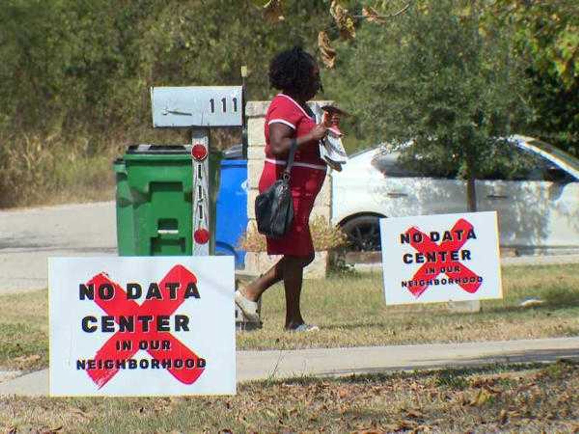 Taylor yard signs saying "no data center in our neighborhood"