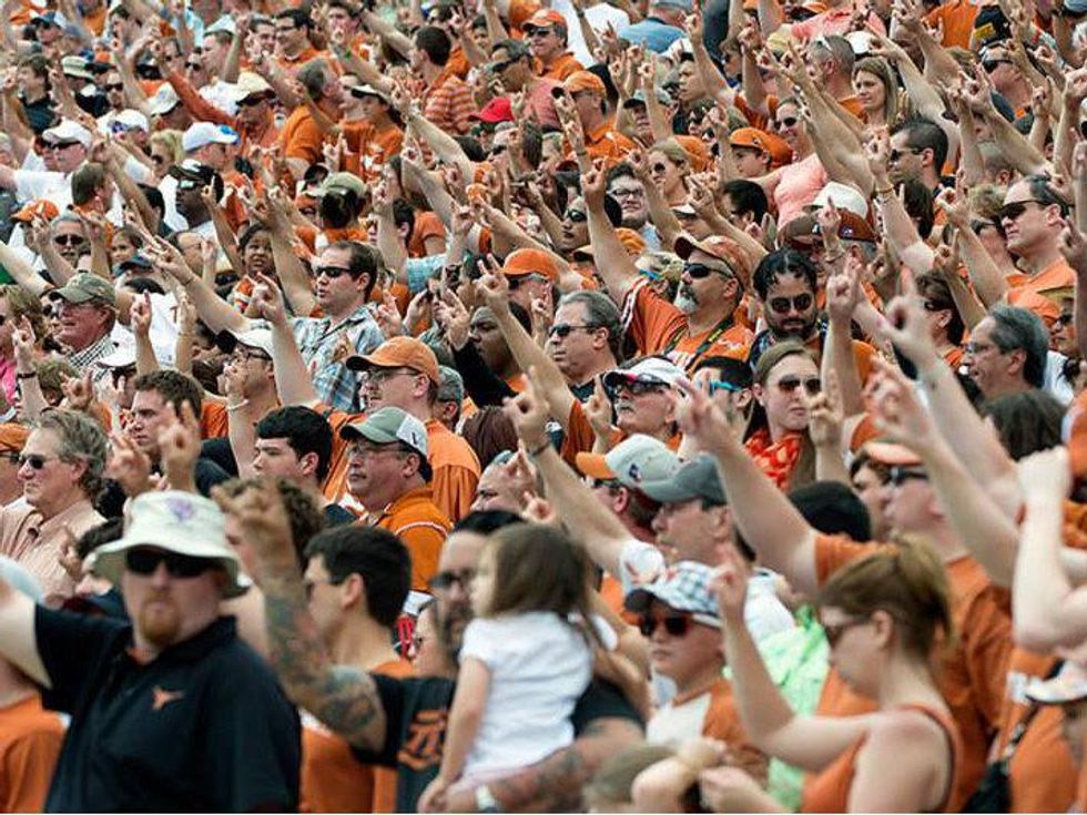 Texas Longhorn fans at DKR giving hook em for spring game