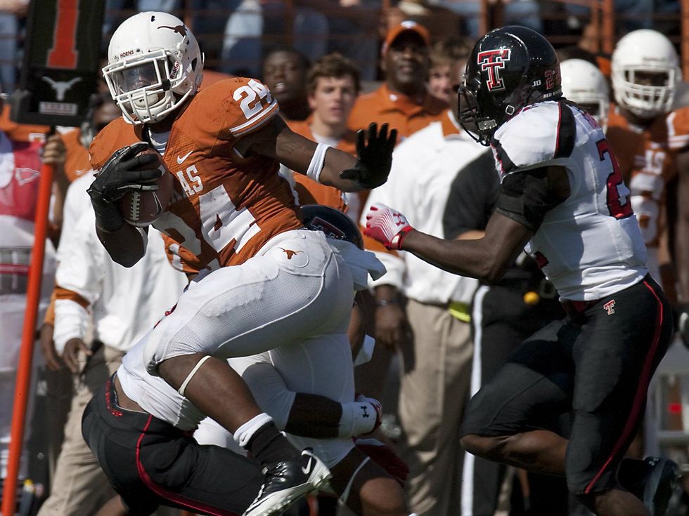 Texas running back Joe Bergeron breaks away from Texas Tech's Jarvis Phillips in Austin 2011