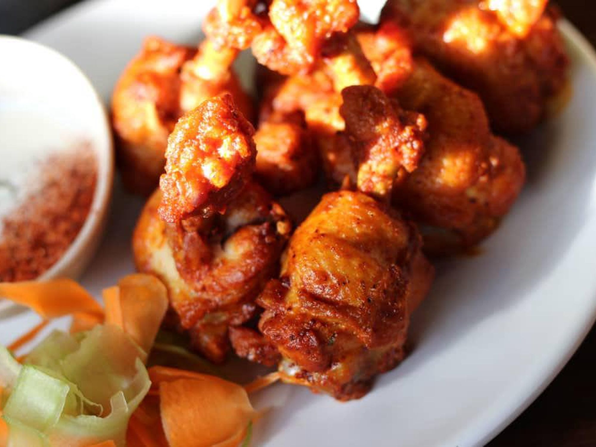 The lollipop wings (upscale Buffalo wings) are emblematic of Provision Dining House's commitment to refining the classics.