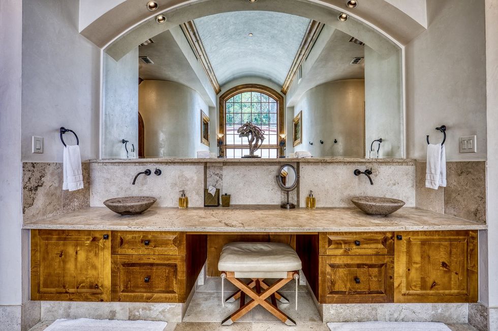 The vanity has two sinks, suitable for couples.