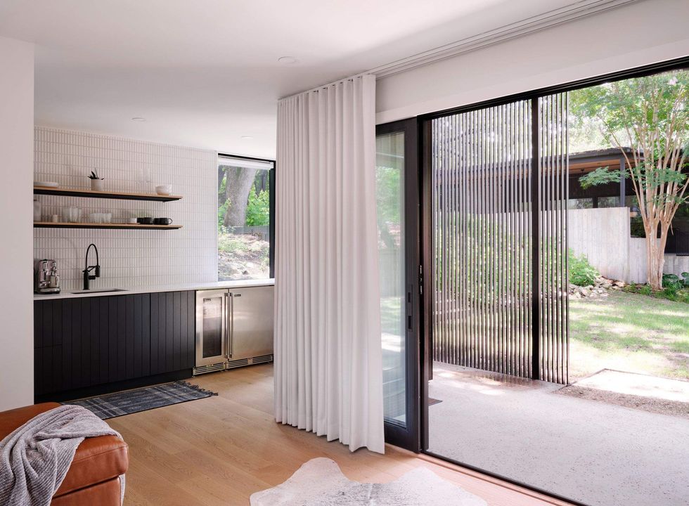 This home off of Bridle Path is modern but includes warm accents like light wood floors