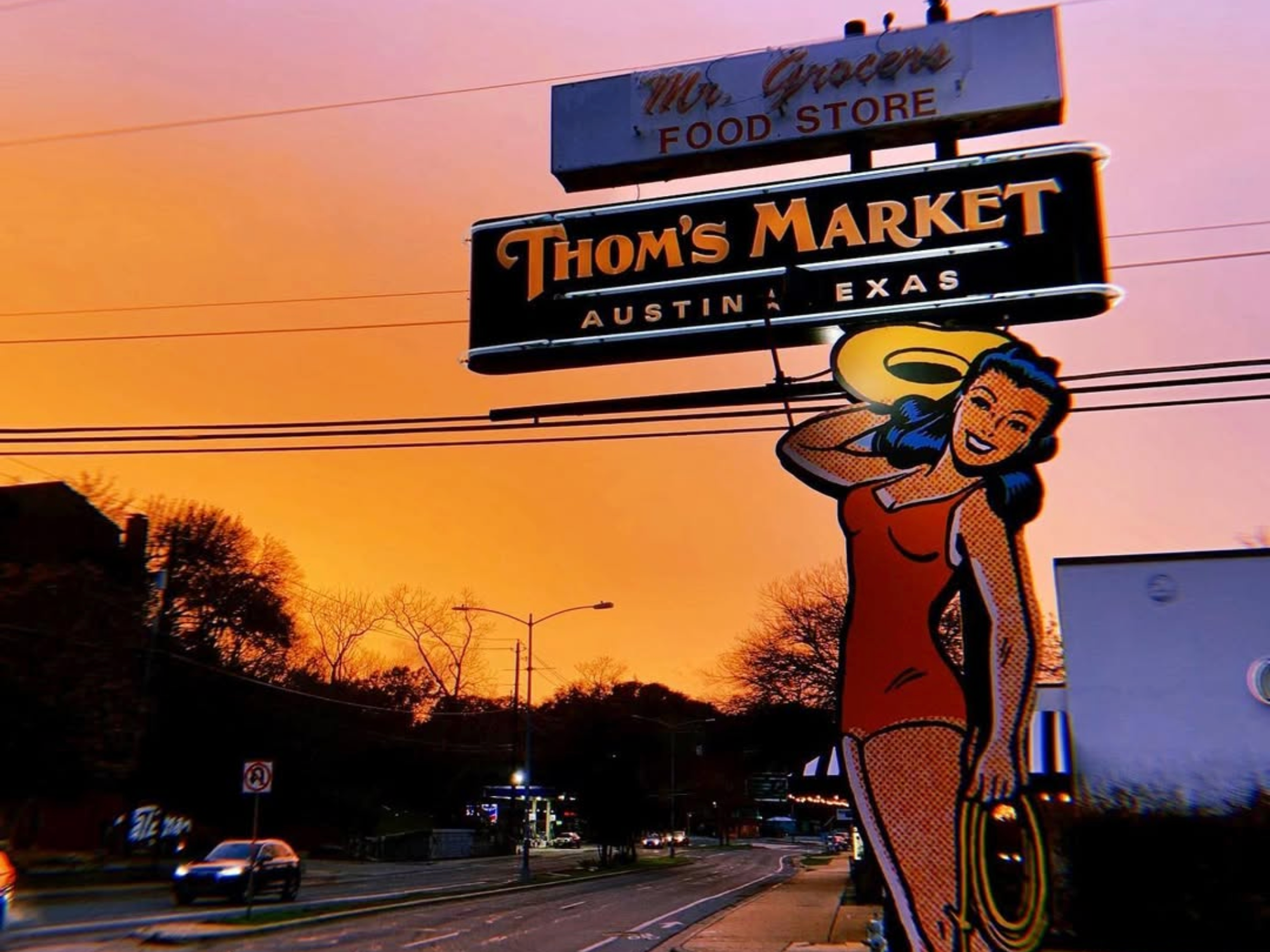 Thom's Market cowgirl sign