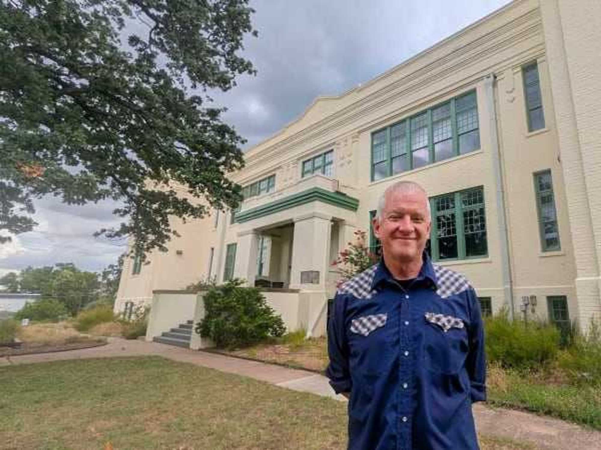Tim League in front of the Baker School