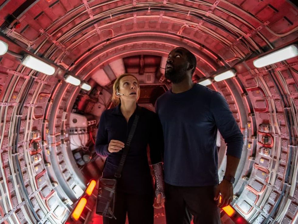 Toni Collette and Shamier Anderson in Stowaway