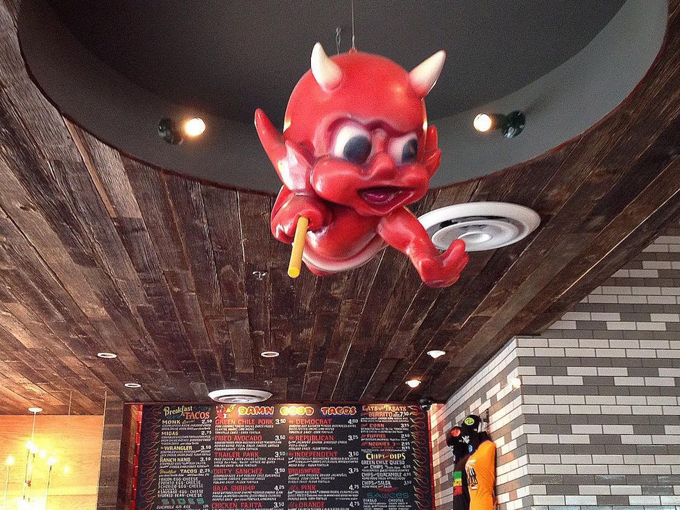 Torchy's Tacos interior with red devil balloon