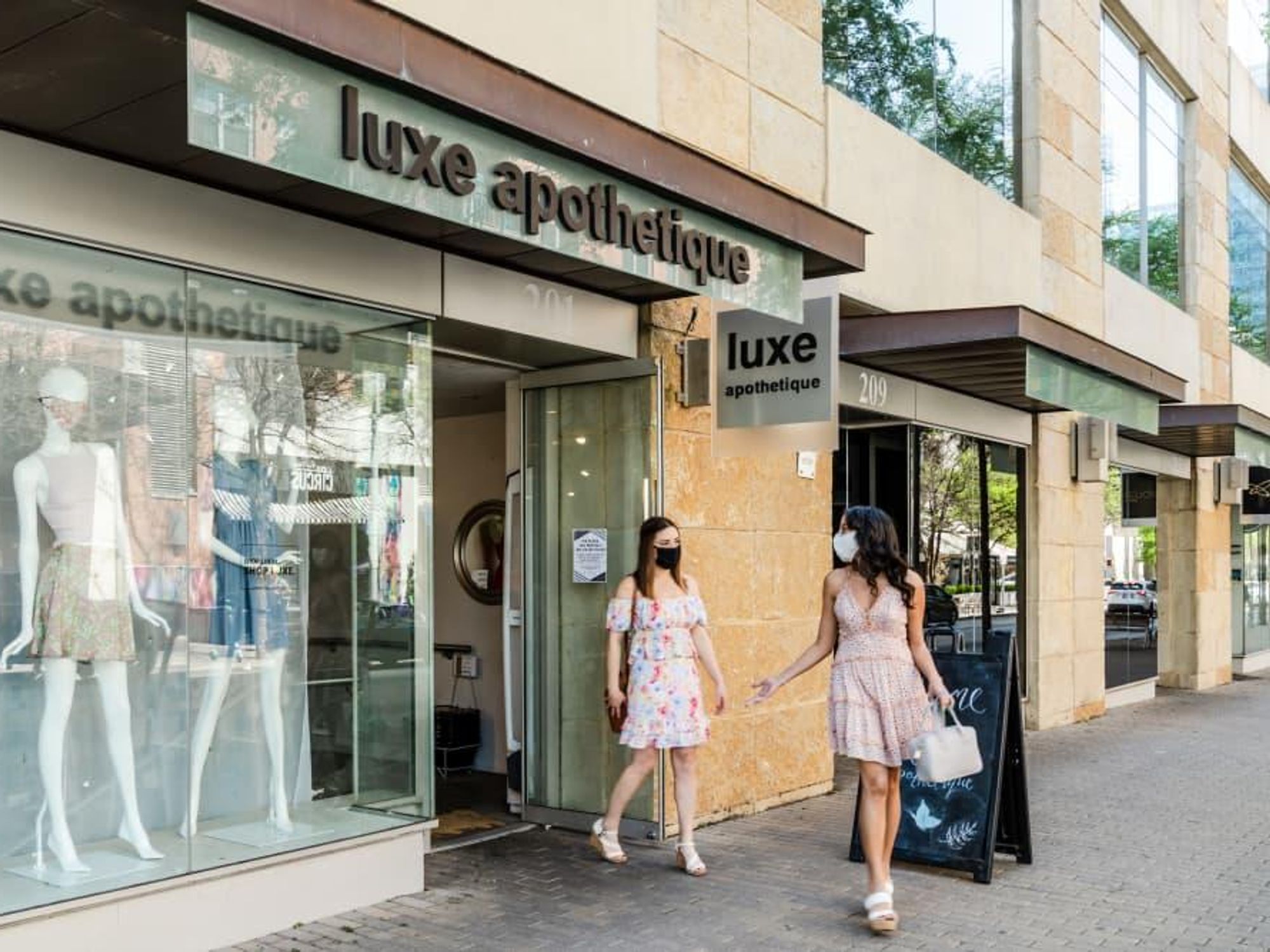 Two masked women shopping