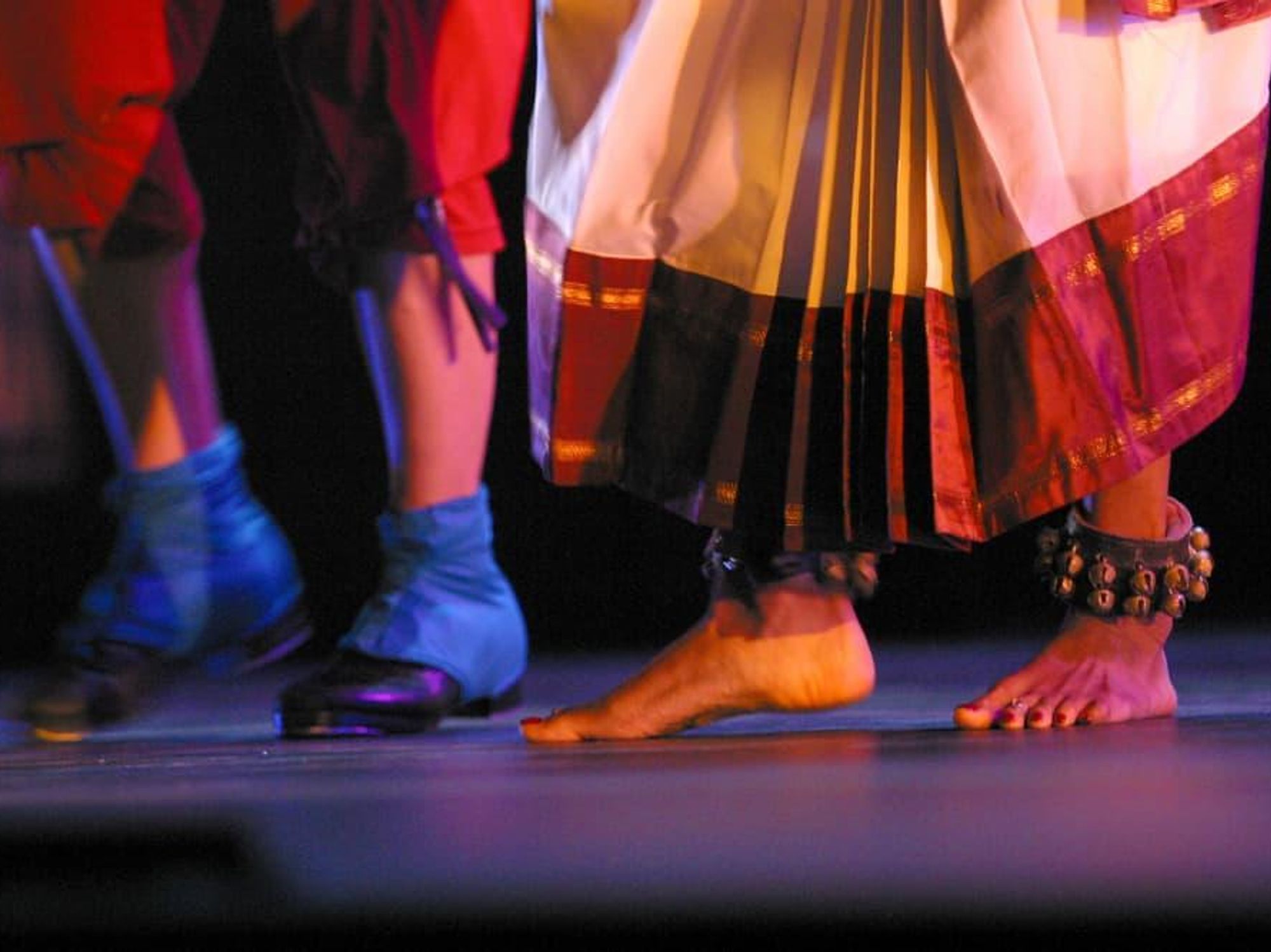 Two sets feet, traditionally adorned, dance onstage