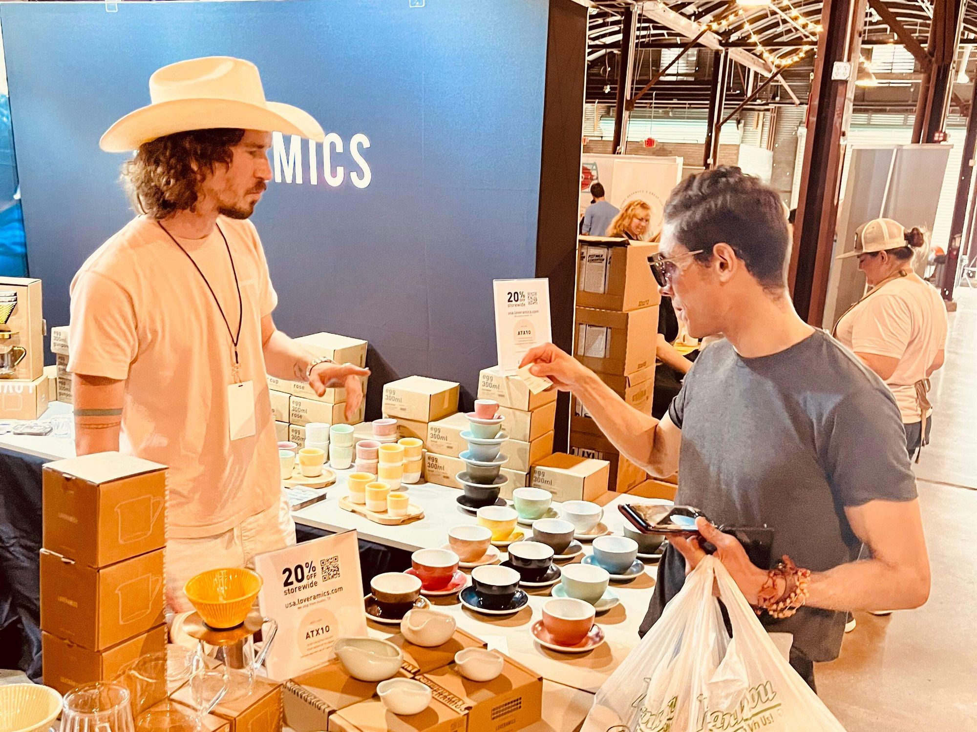 Vendor selling cups at 2023 Austin Coffee Festival