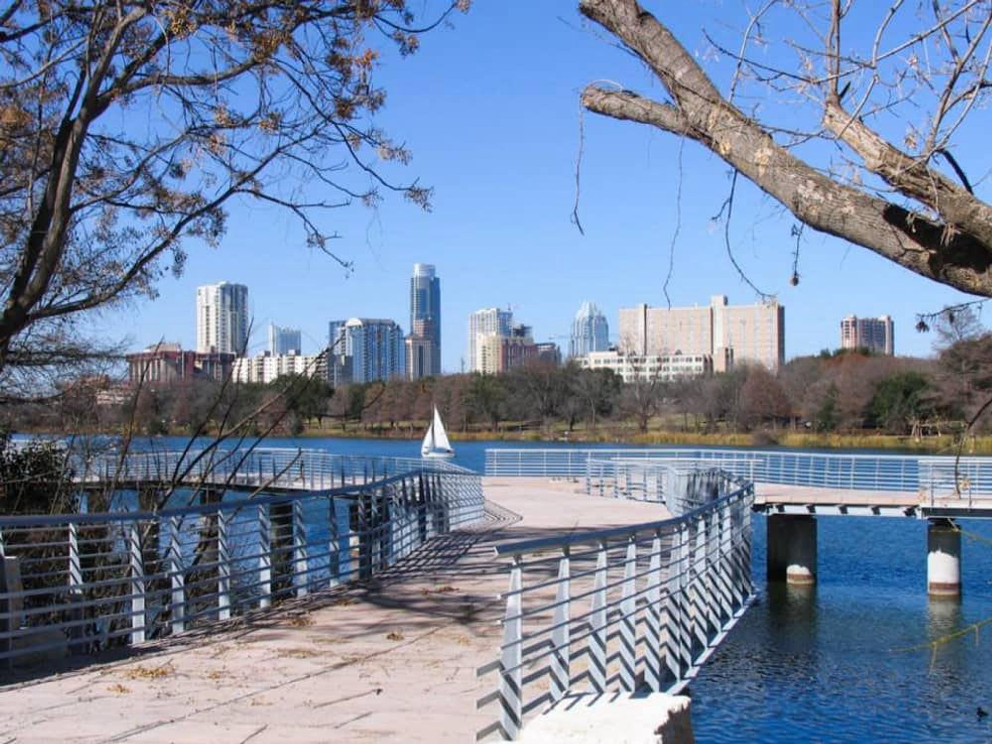 view of downtown Austin from Boardwalk Trail on Lady Bird Lake