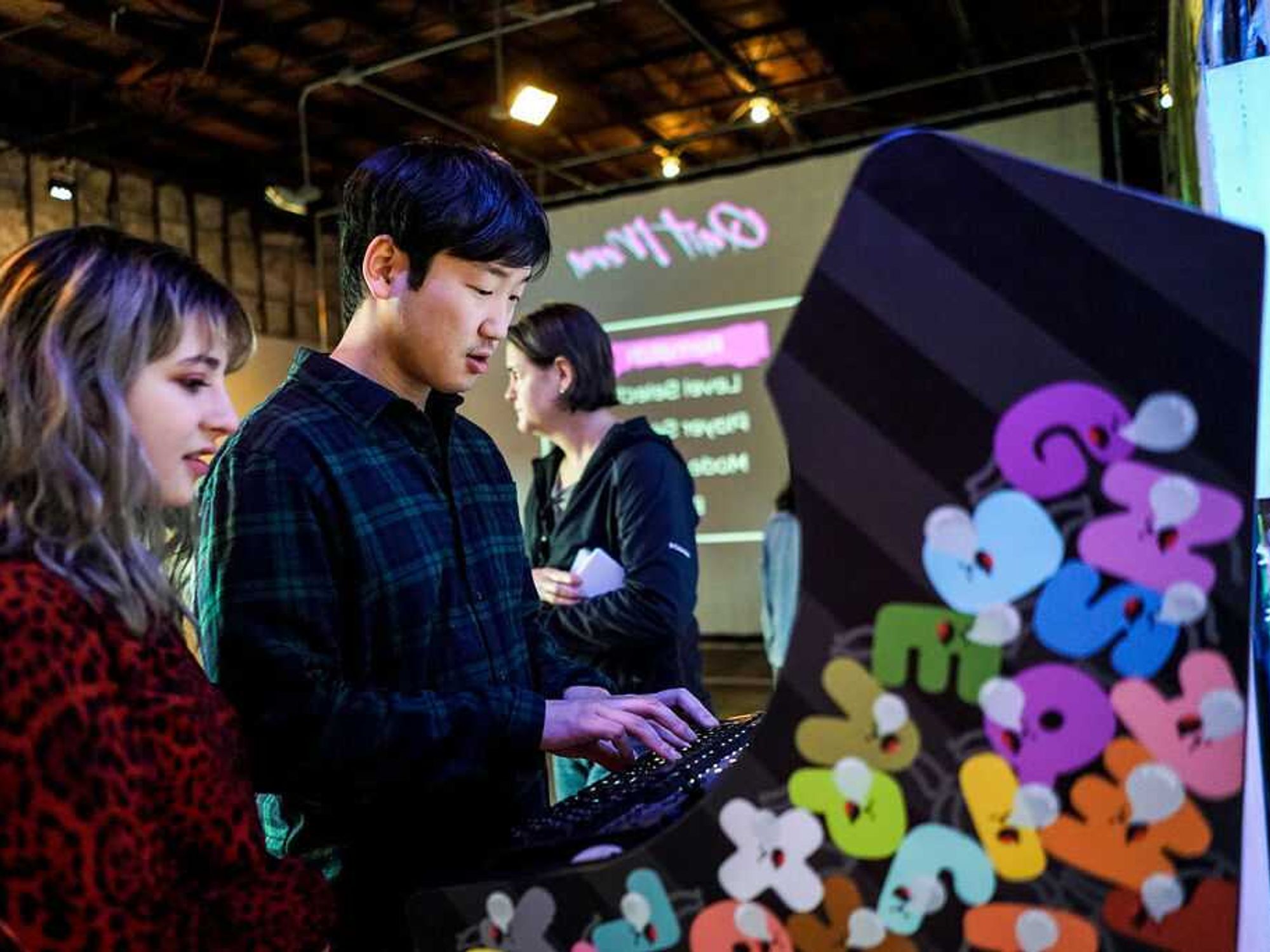 Visitors to the Museum of Human Achievement play Alphabet by Keita Takahashi and Adam Saltsman