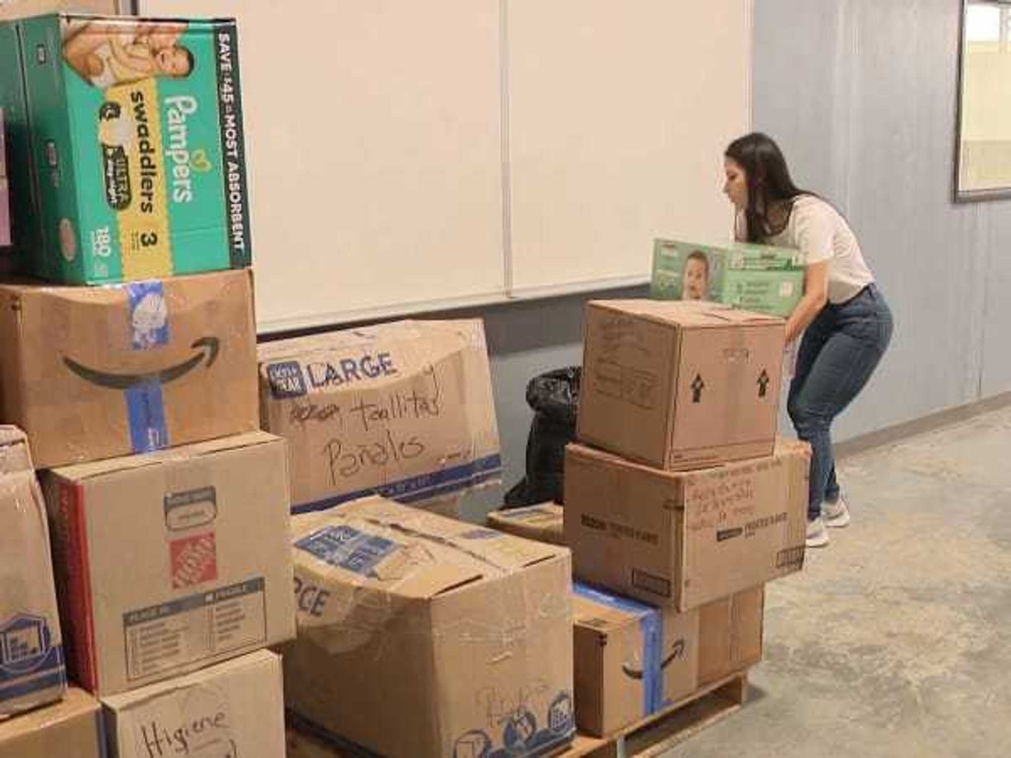 Volunteer sorting earthquake relief boxes
