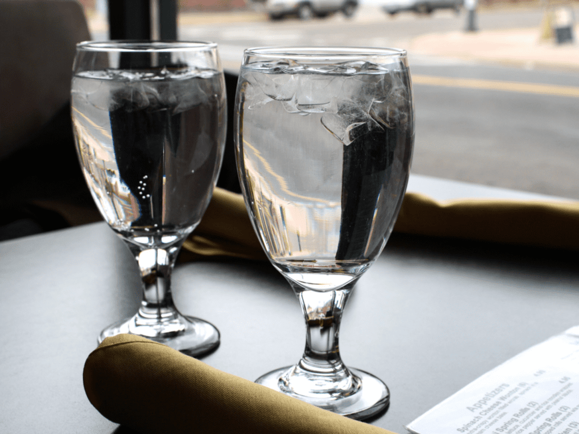 water glasses, glass of water, restaurant table