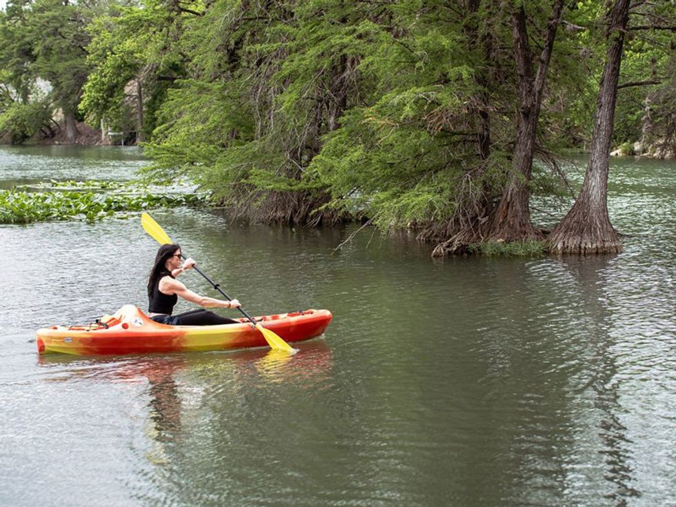 Woman kayaking at Riverside Park in Kerrville