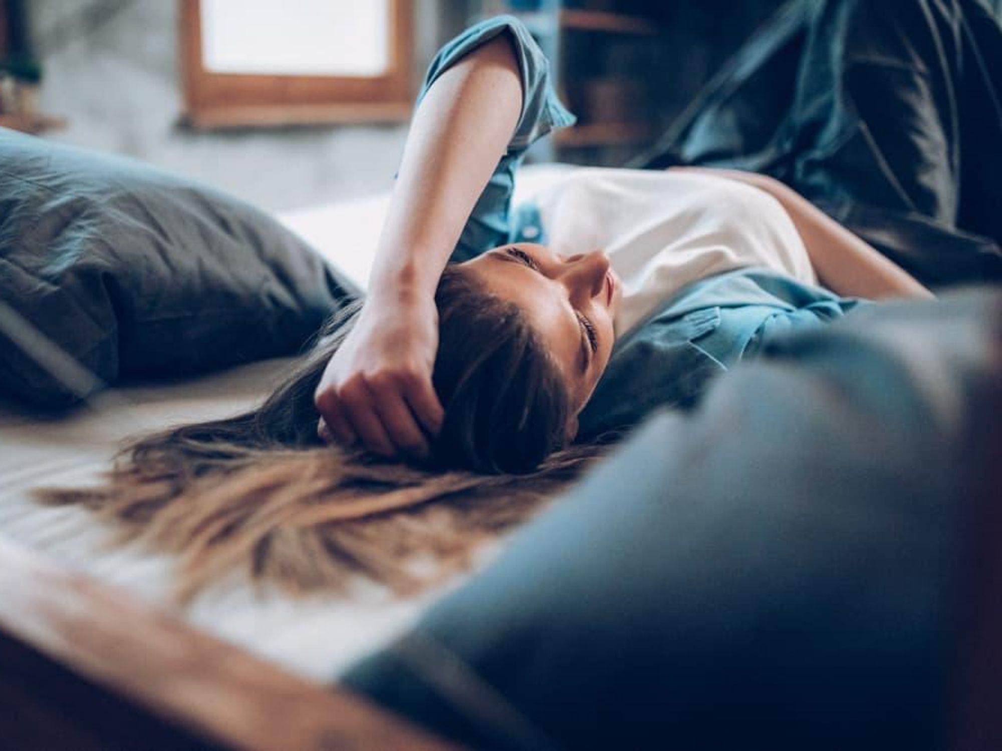 Woman lying on a bed