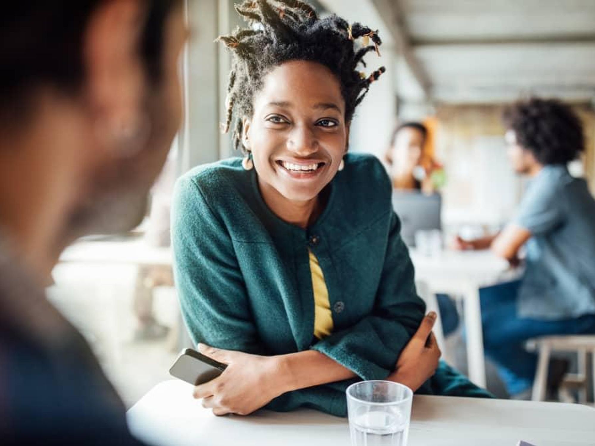 Woman smiling at friend