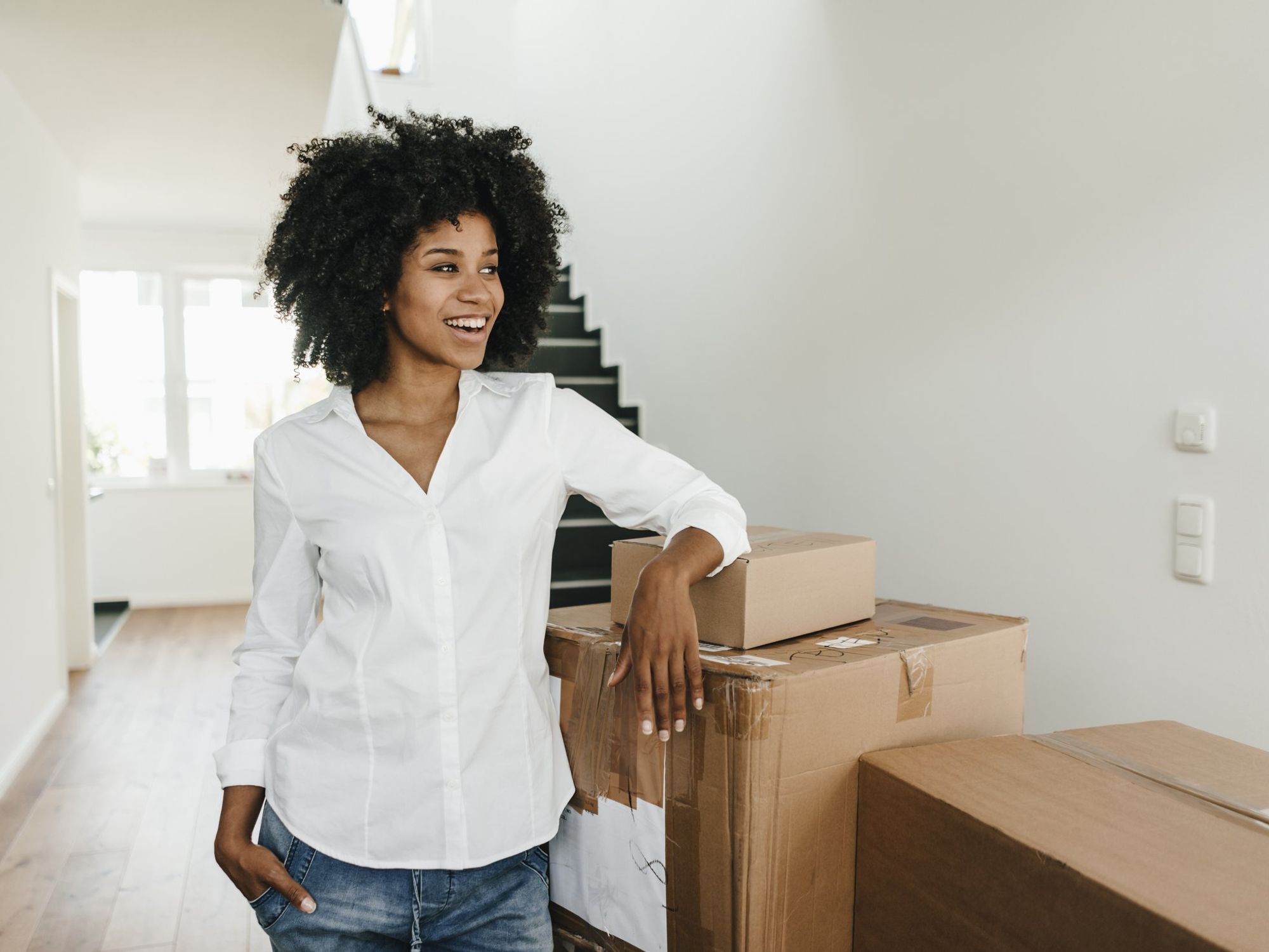 Woman with boxes moving day new house
