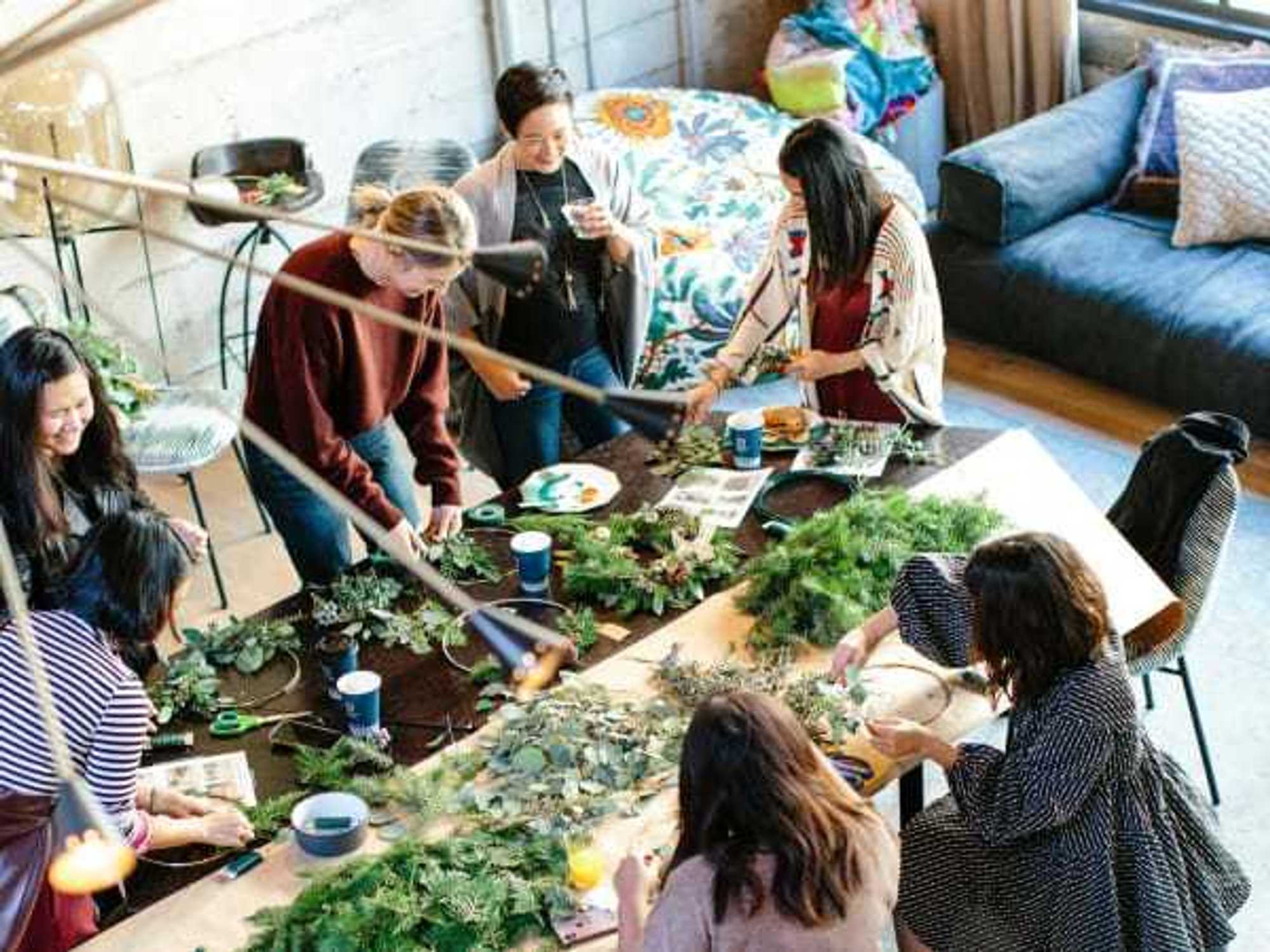 Women making wreaths together