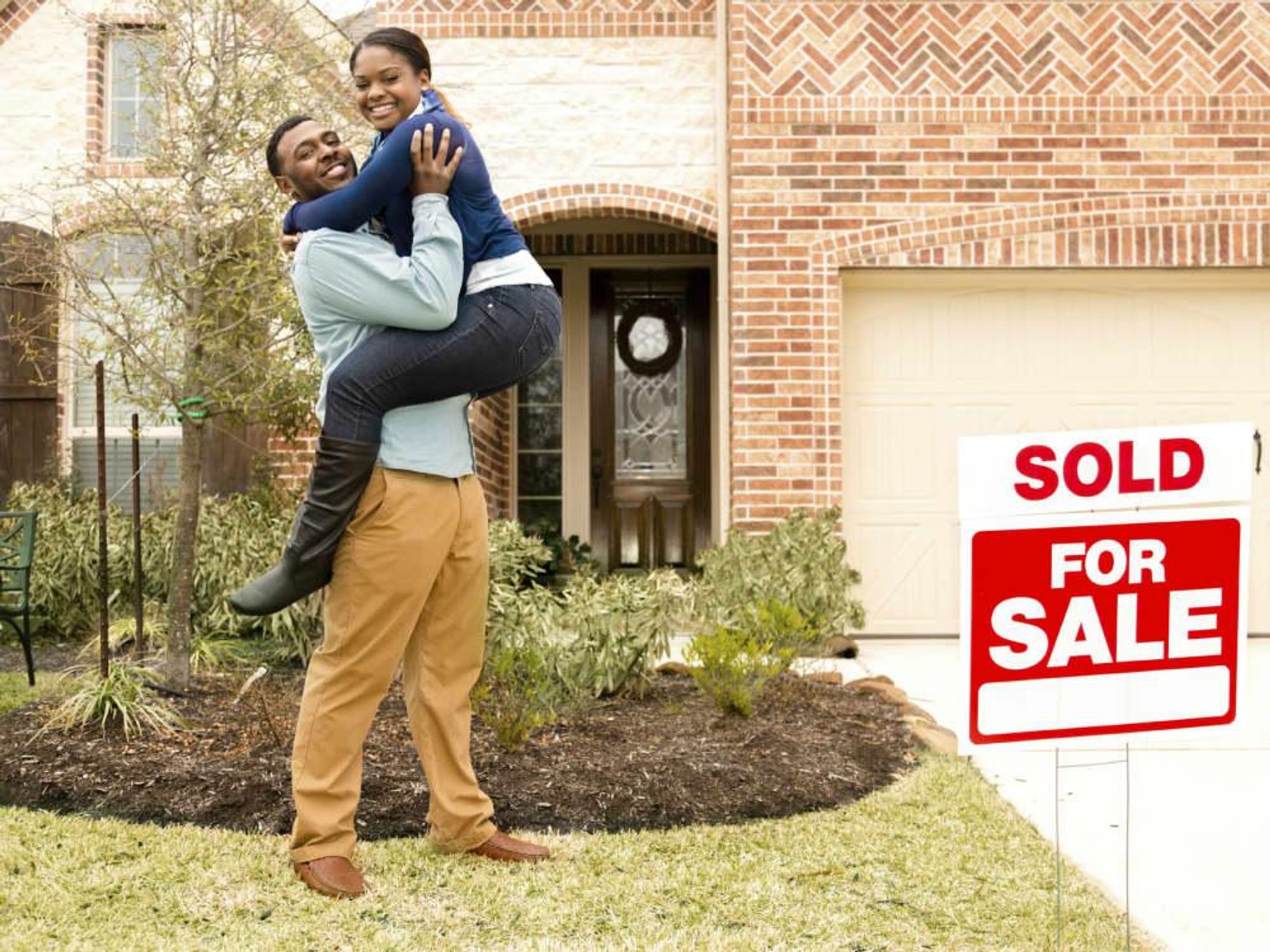 Young couple buying their first house